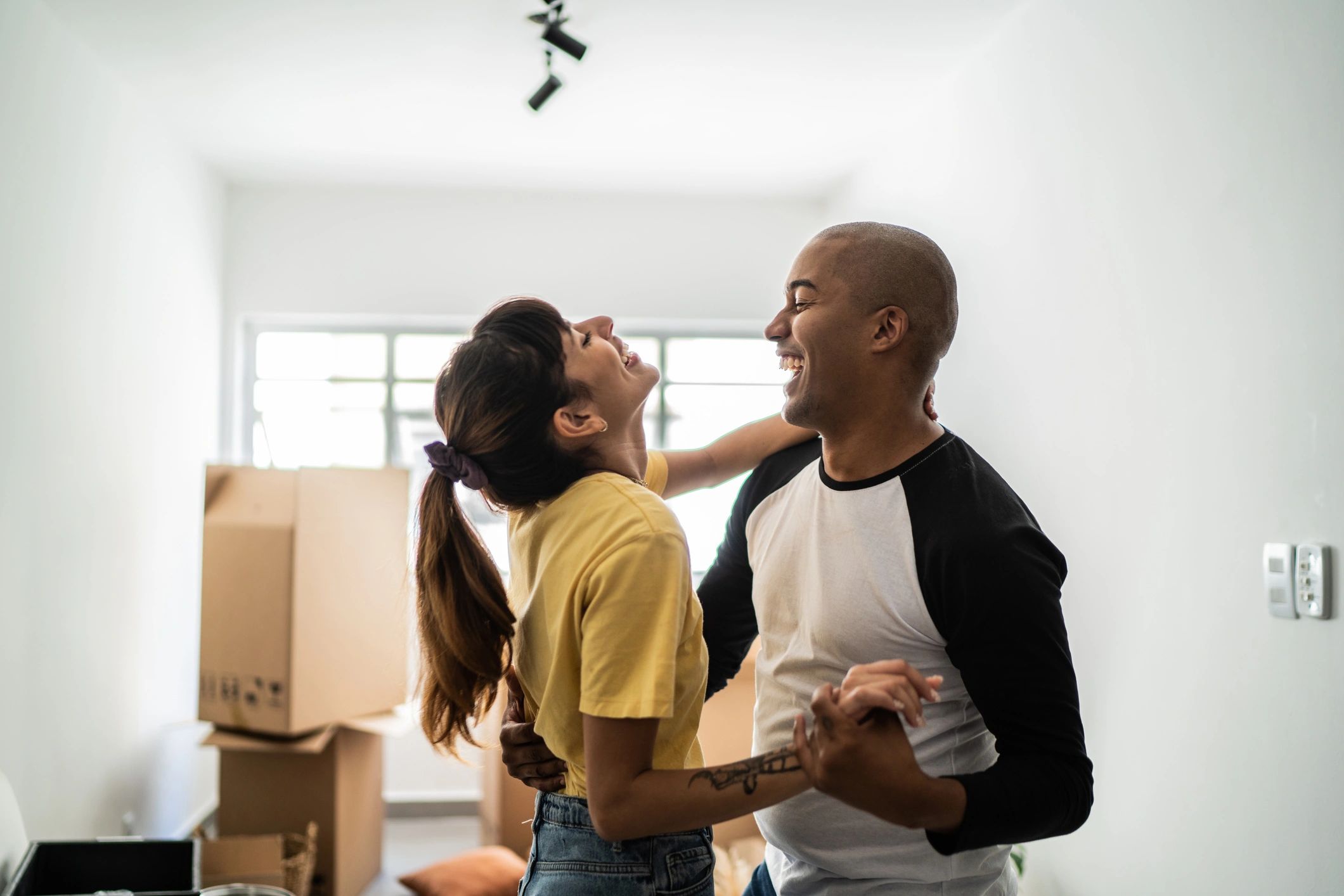 Happy homeowners celebrating a successful move into a new home
