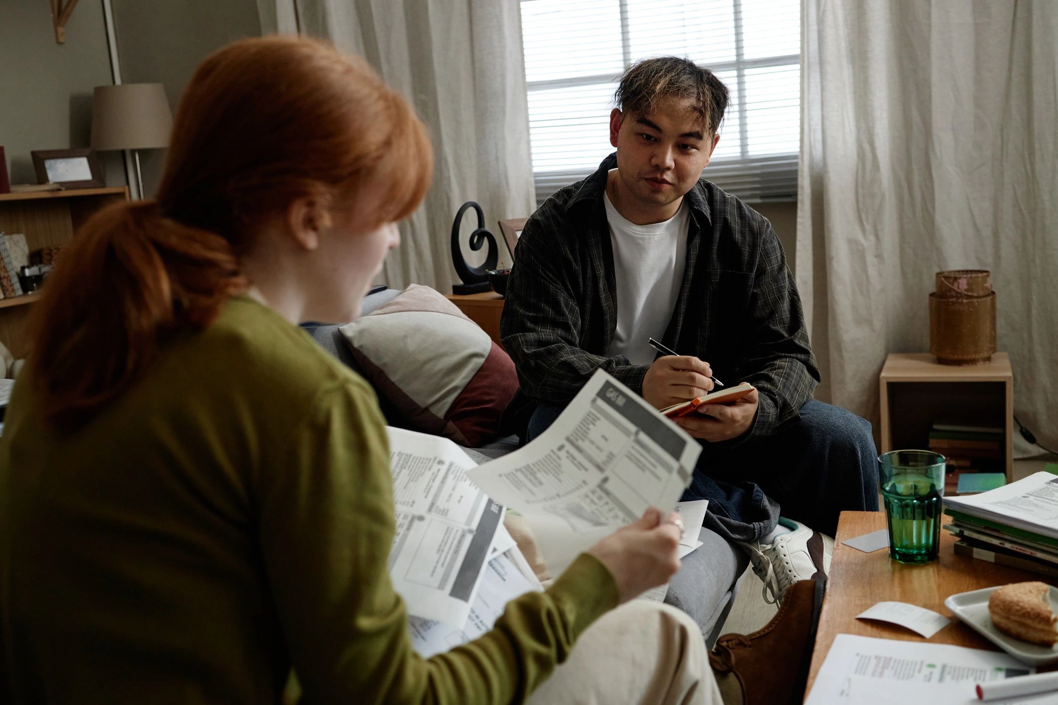 Mortgage consultation with advisor reviewing paperwork